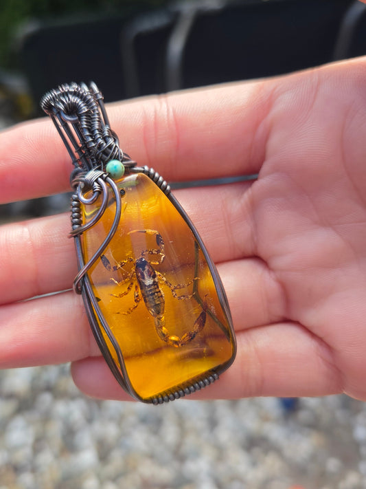Scorpion Amulet in Amber Colored Resin