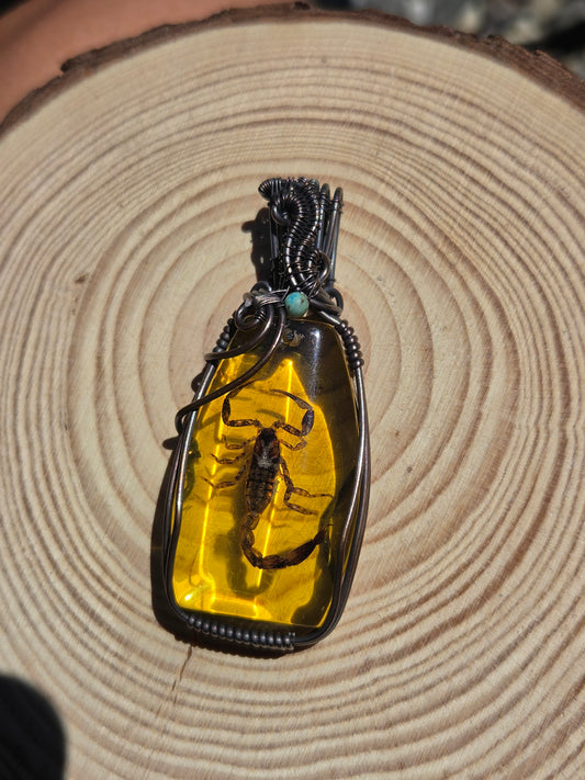 Scorpion Amulet in Amber Colored Resin